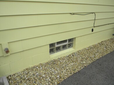 Lower level block glass window