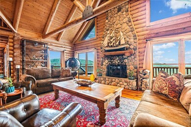 Living room with high vaulted ceiling, wood finish