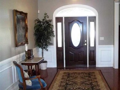 Large entry hall with hardwoods