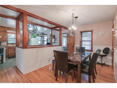 Generous informal dining room with hardwood floors