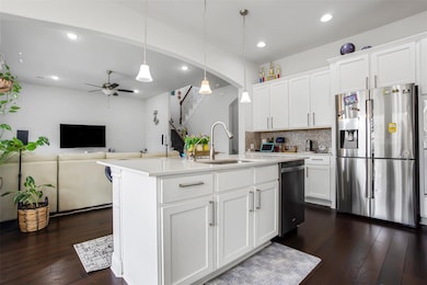 Kitchen with stainless steel appliances, a sink, 