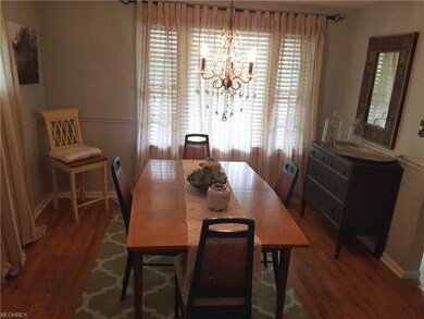 Elegant dining room area with hardwood flooring