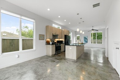 This modern, open-concept space complemented by po