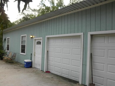 Enclosed patio addition and double garage
