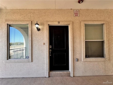 Property entrance with stucco siding