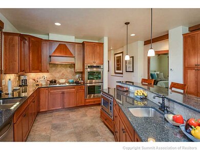 Kitchen. Spacious kitchen is spotless and ready fo