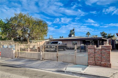 View of front facade with a fenced front yard, a g