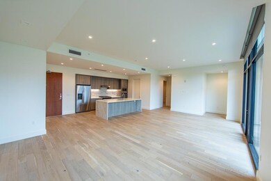 Kitchen featuring a center island with sink, visi