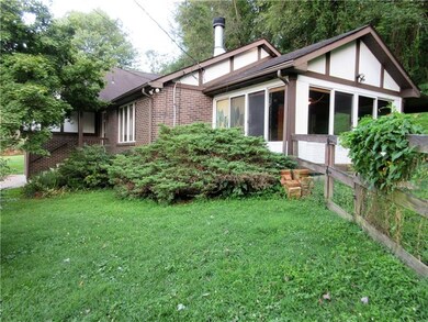 Side view of the home and four season room.