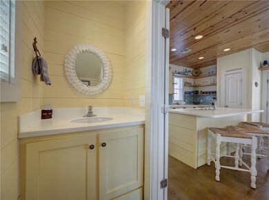Powder room located off kitchen.