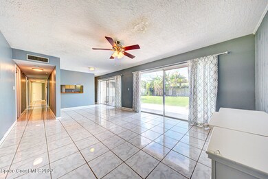living room with slider to backyard