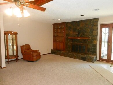 Fireplace, built-in shelves, ceiling fan, amazing 