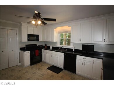 Kitchen - Double doors lead to the  formal dining 