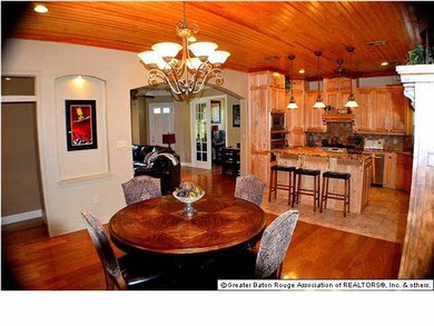 Dining overlooks kitchen area - notice the art nic