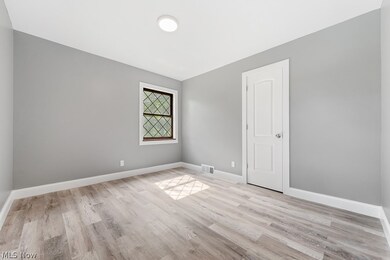 Unfurnished room with light hardwood / wood-style floors
