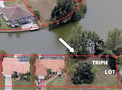 Aerial perspective of suburban area featuring property boundaries highlighted and a nearby body of water