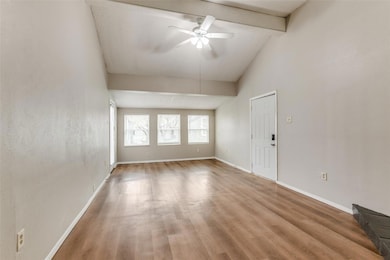 Spare room with high vaulted ceiling, wood finishe