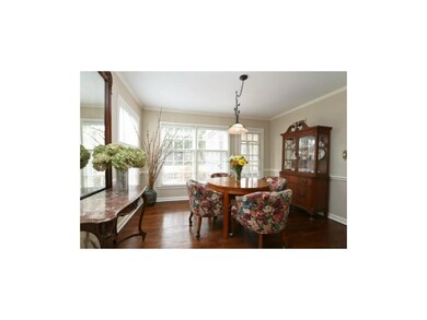 Bright dining room with lots of windows.
