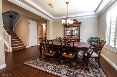 Formal dining room features shutters, tile floorin