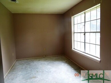 Living Room with lots of natural light.  Wall to l