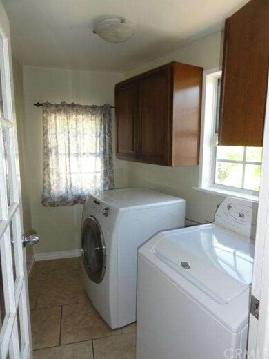 Separate laundry room off kitchen