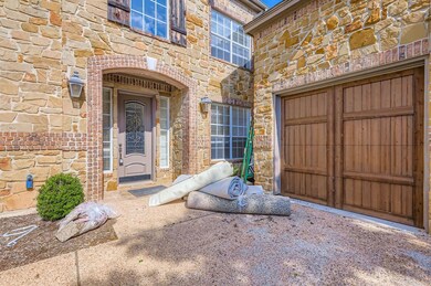 Doorway to property featuring stone siding