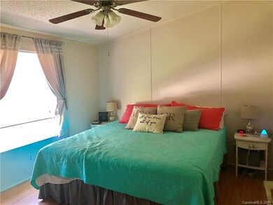 Master bedroom with attached bath to the right.