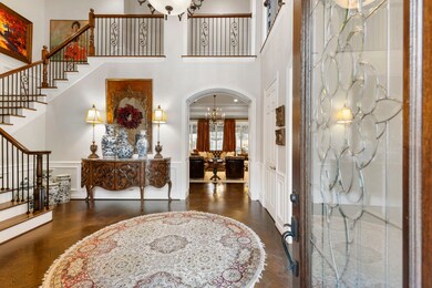 Two story entry with Parquet Floors and Block Pane