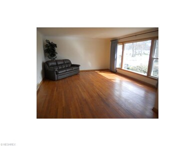 Spacious Living Room with Hardwood Floors and Newe