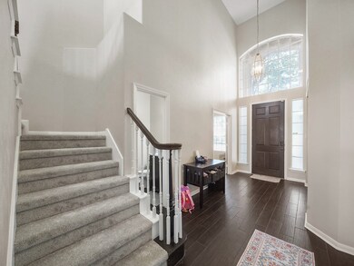 Alternative view of the entry showcasing the high ceiling and light filled area!