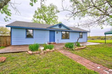 Ranch-style home with a front lawn