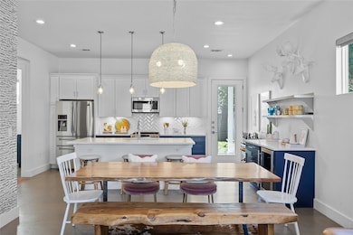 Dining area with baseboards, recessed lighting, a