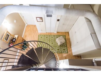 Custom closets in dramatic two-story foyer
