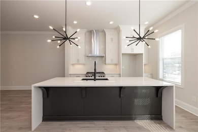 The chef's kitchen boasts quartz waterfall counter