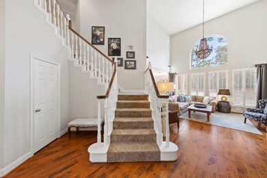 With soaring high ceilings and a striking staircas