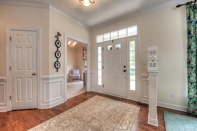 Open Foyer with its gleaming hardwood floors and 9