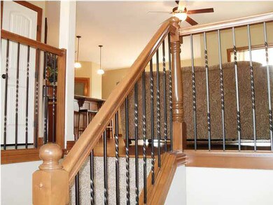 Wood and iron railing on stair to basement