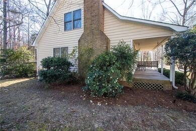 Left side of house with lots of nice plants & bush