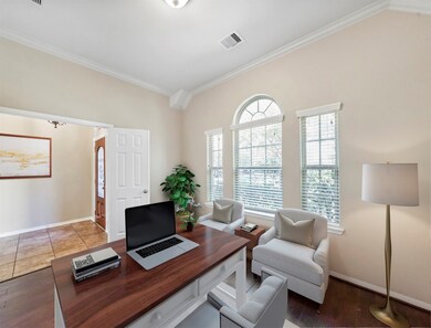 Quietly tucked away in the front of the home is the grand home office, featuring double doors, beautiful large windows with privacy blinds, neutral paint, crown molding, and gorgeous wood floors!

Sit back and relax in your personal media 
room featuring trey ceilings and plush carpet.