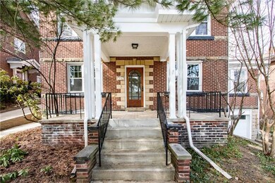 Beveled glass front door and large front covered p