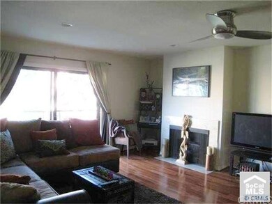 Living Room with wood flooring & fireplace