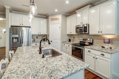 Kitchen featuring hanging light fixtures, ornament