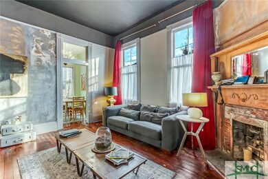 Bottom floor living area with original fireplace