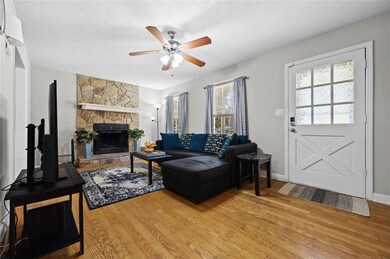 Living Room with stone front fireplace