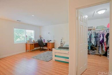 Upstairs you have this large bedroom with a walk i