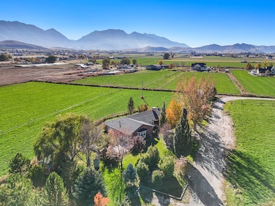 Overview of rural landscape featuring mountains and extensive farmland