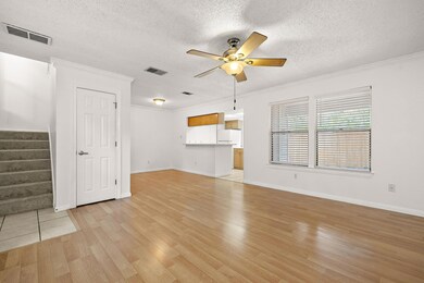 Unfurnished living room with stairway, ornamental