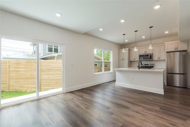 Kitchen featuring appliances with stainless steel