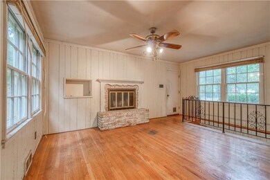 Family room has wood burning fireplace.