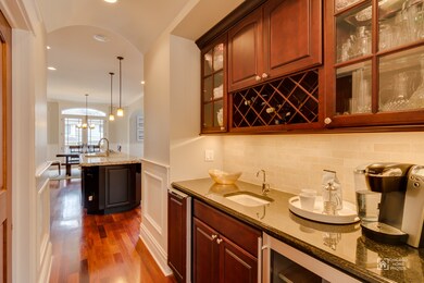 Butlers pantry with wine cooler and ice maker, plu